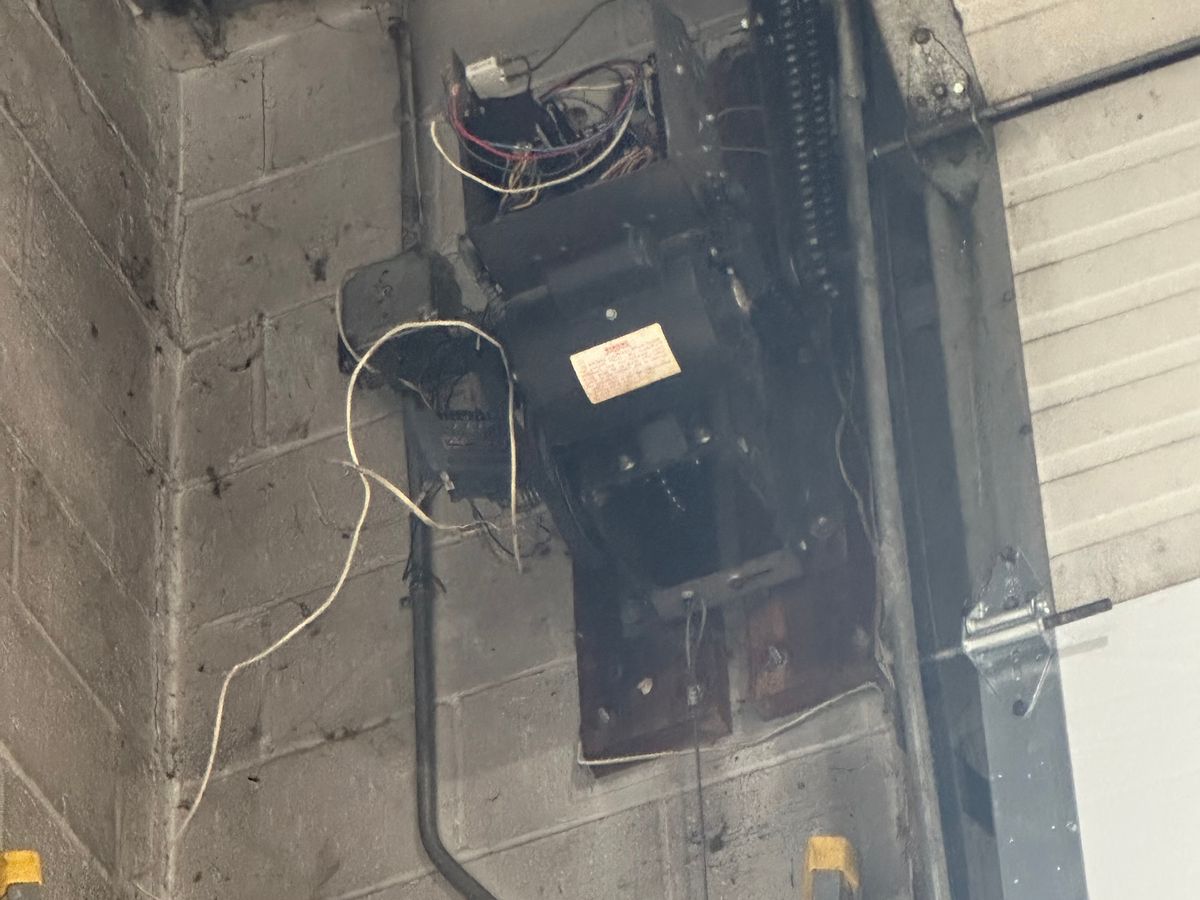 LiftMaster commercial opener and spring system installed on ceiling — Massachusetts